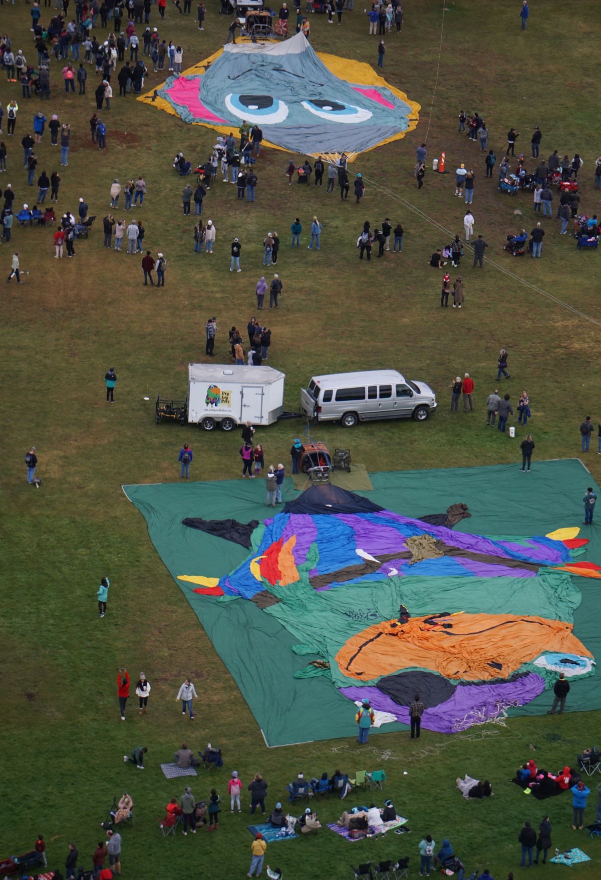 A group of people experiencing a balloon festival.