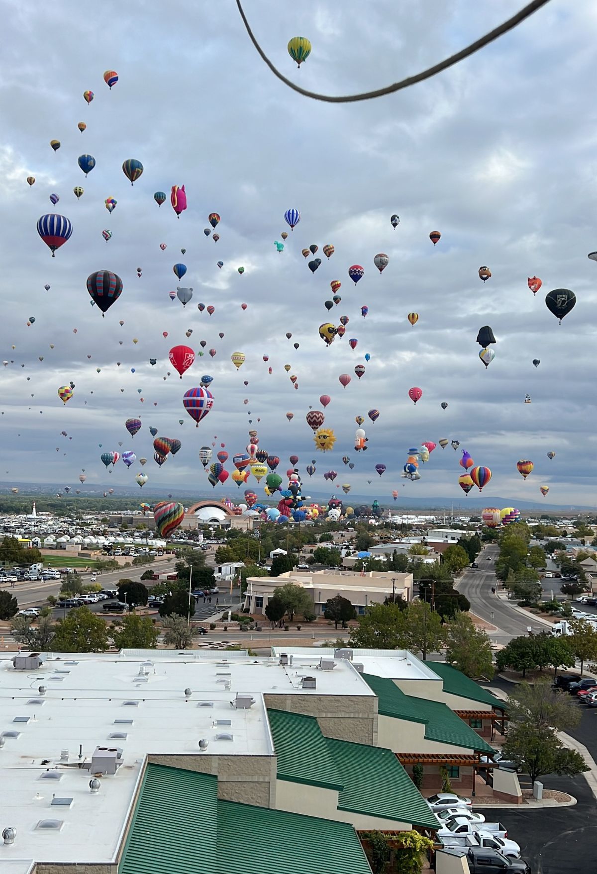 A large number of hot air balloons flying in the sky.