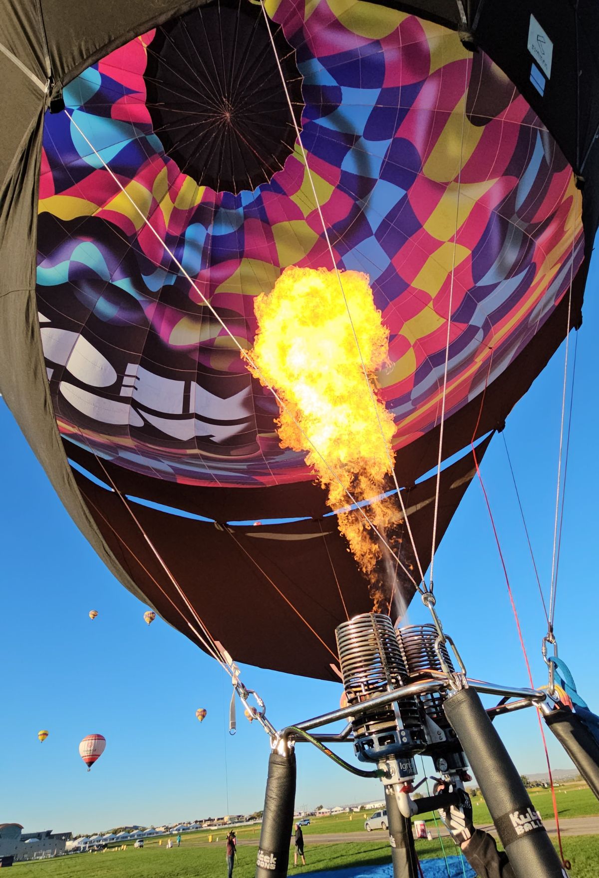 A hot air balloon with flames coming out of it.