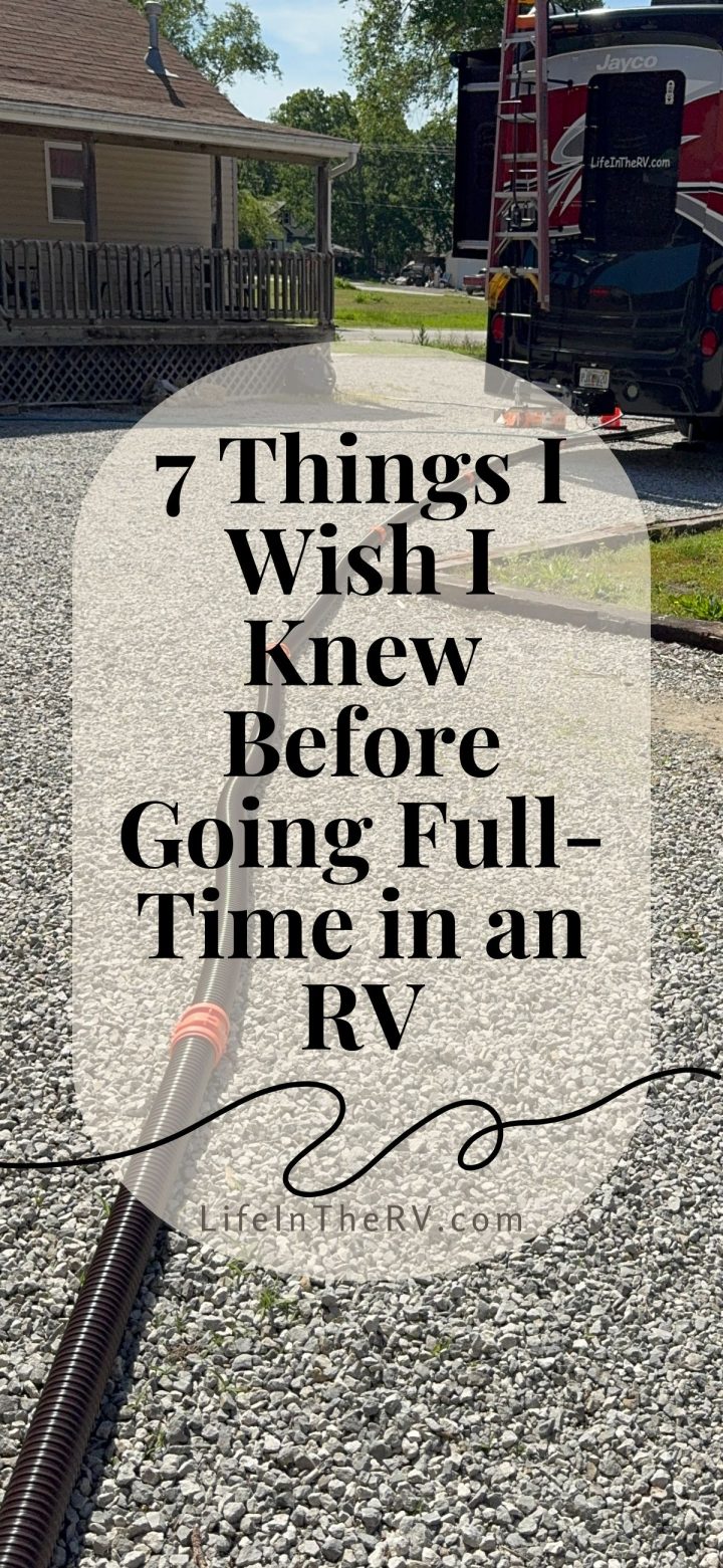 Gravel RV campsite with a hose connected to an RV. Text overlay reads "7 Things I Wish I Knew Before Going Full-Time in an RV." Discover what life is really like living full-time in an RV and essential tips for your journey.