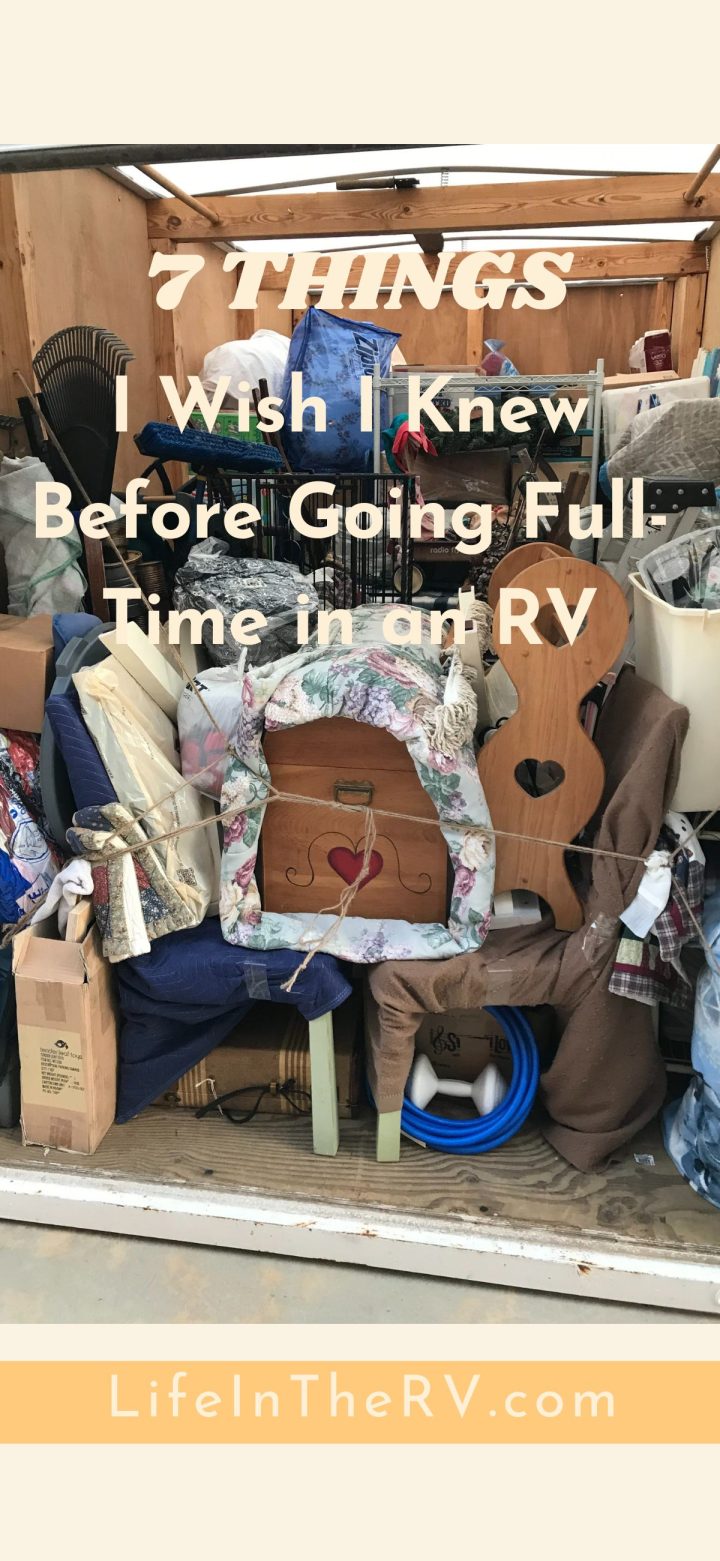 A cluttered RV packed with boxes, furniture, and household items, with overlaid text offering essential tips for anyone considering living full-time in an RV.