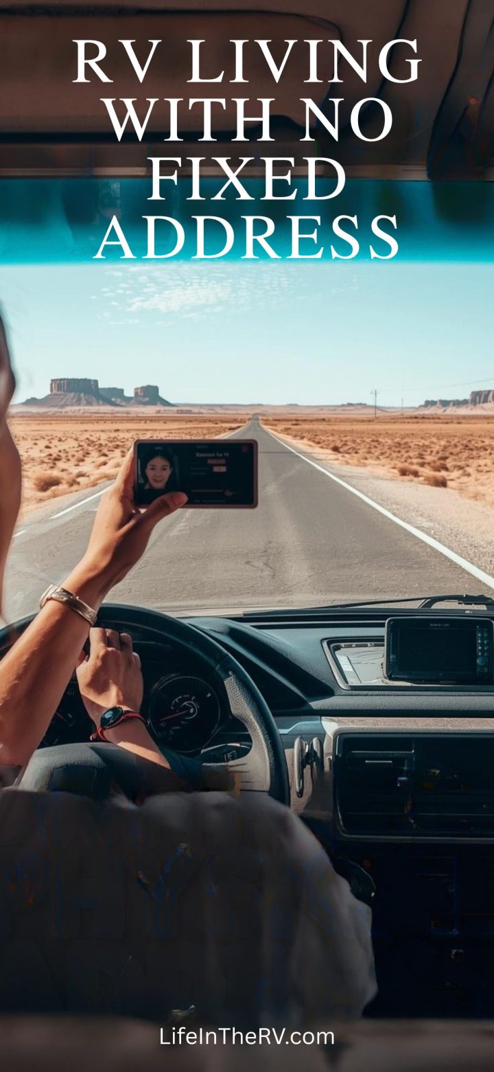 Cruising an empty desert road, a person drives an RV while holding a phone. The text reads "Living Full Time in an RV—No Fixed Address" and "LifeInTheRV.com.